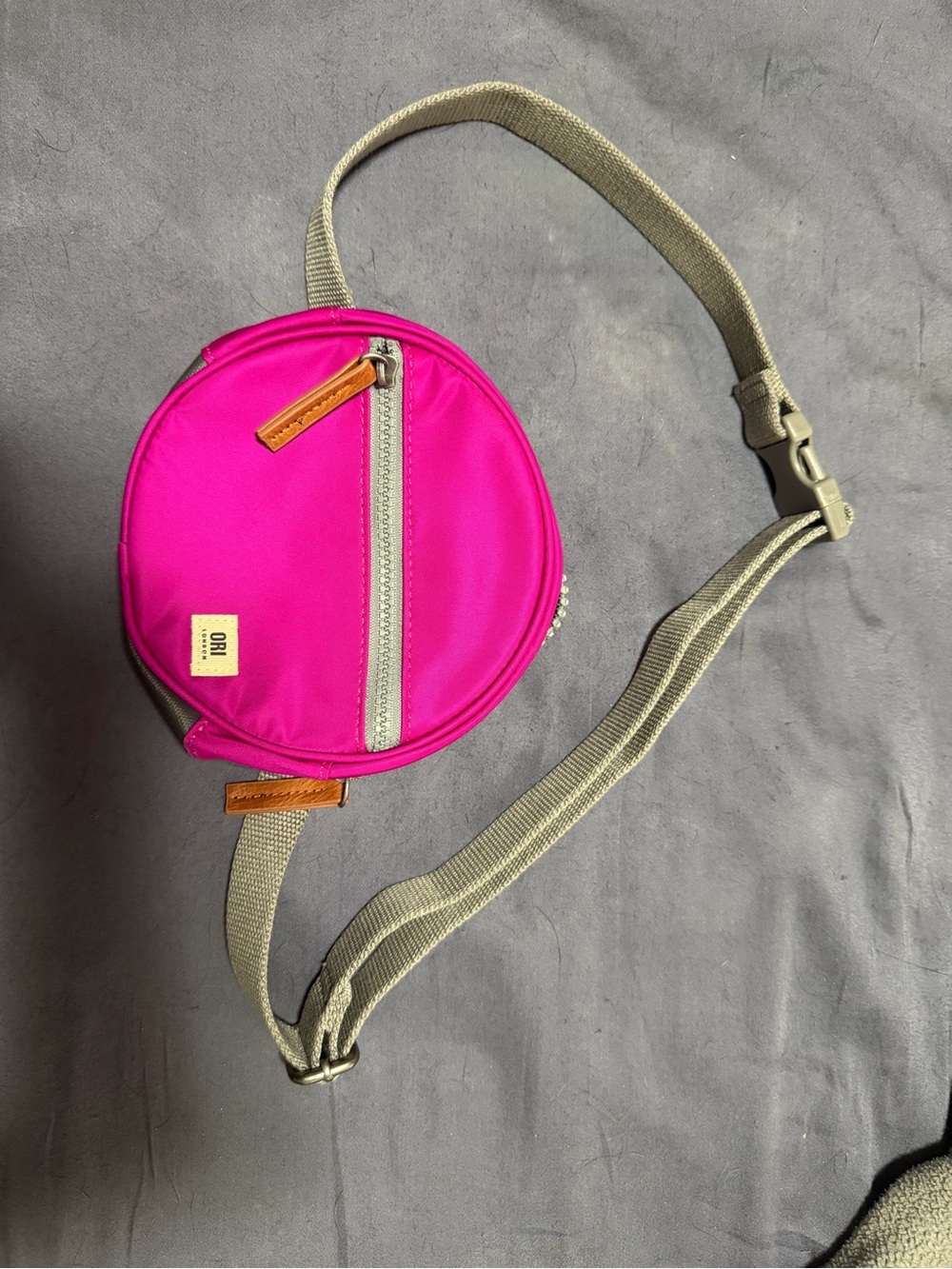 Hot Pink Round Crossbody Bag with Neutral Strap